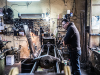 Workers are processing metal to make fasteners for industrial use in a old "han" factory in Istanbul, Turkey, 25 February 2018. This buildin...