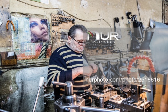 Workers are processing metal to make fasteners for industrial use in a old "han" factory in Istanbul, Turkey, 25 February 2018. This buildin...