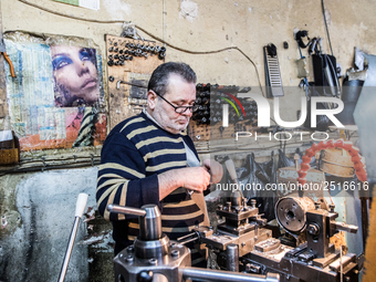 Workers are processing metal to make fasteners for industrial use in a old "han" factory in Istanbul, Turkey, 25 February 2018. This buildin...