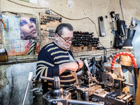 Workers are processing metal to make fasteners for industrial use in a old "han" factory in Istanbul, Turkey, 25 February 2018. This buildin...