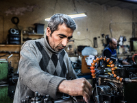 Workers are processing metal to make fasteners for industrial use in a old "han" factory in Istanbul, Turkey, 25 February 2018. This buildin...