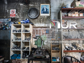 Workers are processing metal to make fasteners for industrial use in a old "han" factory in Istanbul, Turkey, 25 February 2018. This buildin...