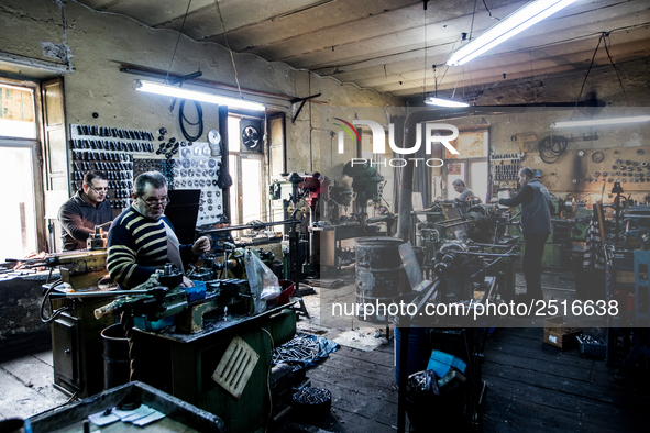 Workers are processing metal to make fasteners for industrial use in a old "han" factory in Istanbul, Turkey, 25 February 2018. This buildin...