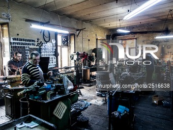 Workers are processing metal to make fasteners for industrial use in a old "han" factory in Istanbul, Turkey, 25 February 2018. This buildin...