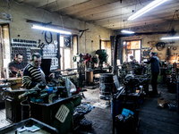 Workers are processing metal to make fasteners for industrial use in a old "han" factory in Istanbul, Turkey, 25 February 2018. This buildin...