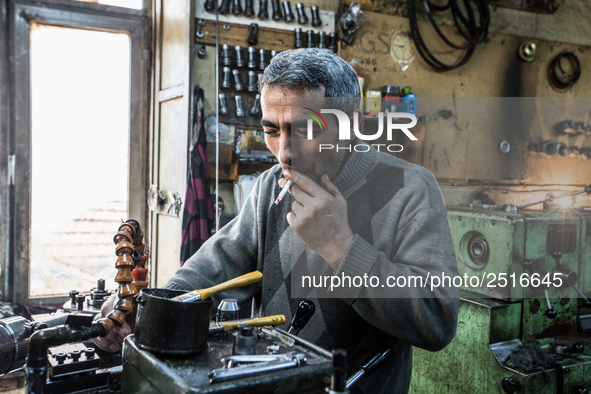 Workers are processing metal to make fasteners for industrial use in a old "han" factory in Istanbul, Turkey, 25 February 2018. This buildin...