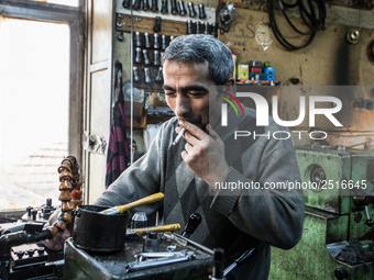 Workers are processing metal to make fasteners for industrial use in a old "han" factory in Istanbul, Turkey, 25 February 2018. This buildin...