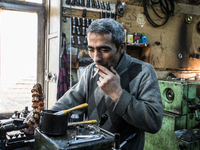 Workers are processing metal to make fasteners for industrial use in a old "han" factory in Istanbul, Turkey, 25 February 2018. This buildin...