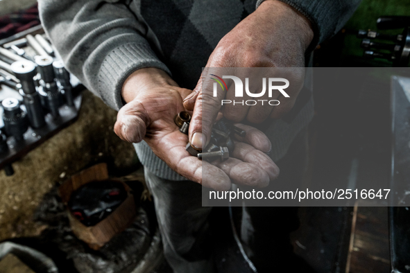 Workers are processing metal to make fasteners for industrial use in a old "han" factory in Istanbul, Turkey, 25 February 2018. This buildin...