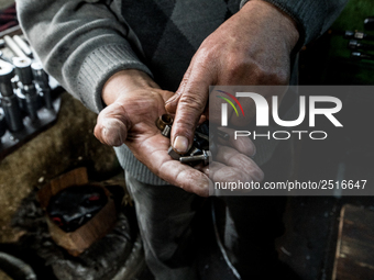 Workers are processing metal to make fasteners for industrial use in a old "han" factory in Istanbul, Turkey, 25 February 2018. This buildin...