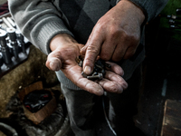 Workers are processing metal to make fasteners for industrial use in a old "han" factory in Istanbul, Turkey, 25 February 2018. This buildin...