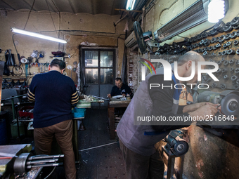 Workers are processing metal to make fasteners for industrial use in a old "han" factory in Istanbul, Turkey, 25 February 2018. This buildin...