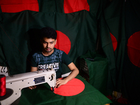 A worker is sewing the national flag of Bangladesh for upcoming event Independence Day on March 26 in Dhaka, Bangladesh, on March 05, 2018....