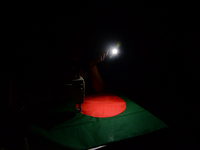 A worker is sewing the national flag of Bangladesh for upcoming event Independence Day on March 26 in Dhaka, Bangladesh, on March 05, 2018....