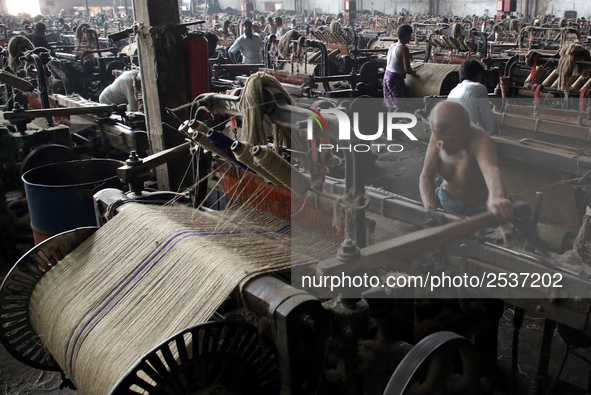 Workers busy in making jute sacks at Latif Bawany Jute Mills in Demra, Dhaka, on 5 March 2018 amid the country is ready to celebrate Nationa...