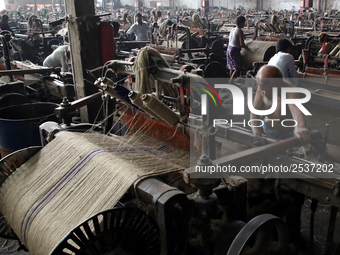 Workers busy in making jute sacks at Latif Bawany Jute Mills in Demra, Dhaka, on 5 March 2018 amid the country is ready to celebrate Nationa...