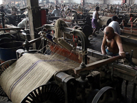 Workers busy in making jute sacks at Latif Bawany Jute Mills in Demra, Dhaka, on 5 March 2018 amid the country is ready to celebrate Nationa...