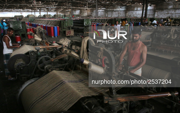 Workers busy in making jute sacks at Latif Bawany Jute Mills in Demra, Dhaka, on 5 March 2018 amid the country is ready to celebrate Nationa...