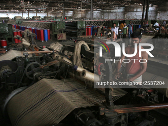 Workers busy in making jute sacks at Latif Bawany Jute Mills in Demra, Dhaka, on 5 March 2018 amid the country is ready to celebrate Nationa...