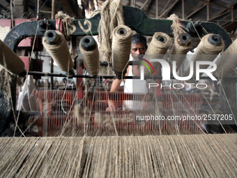 Workers busy in making jute sacks at Latif Bawany Jute Mills in Demra, Dhaka, on 5 March 2018 amid the country is ready to celebrate Nationa...