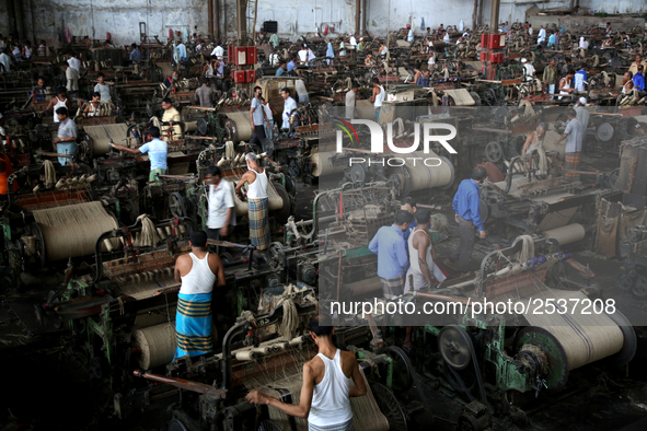 Workers busy in making jute sacks at Latif Bawany Jute Mills in Demra, Dhaka, on 5 March 2018 amid the country is ready to celebrate Nationa...