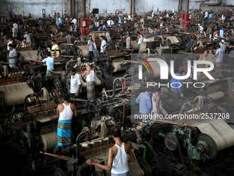 Workers busy in making jute sacks at Latif Bawany Jute Mills in Demra, Dhaka, on 5 March 2018 amid the country is ready to celebrate Nationa...