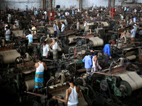 Workers busy in making jute sacks at Latif Bawany Jute Mills in Demra, Dhaka, on 5 March 2018 amid the country is ready to celebrate Nationa...