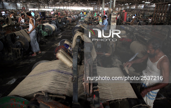 Workers busy in making jute sacks at Latif Bawany Jute Mills in Demra, Dhaka, on 5 March 2018 amid the country is ready to celebrate Nationa...