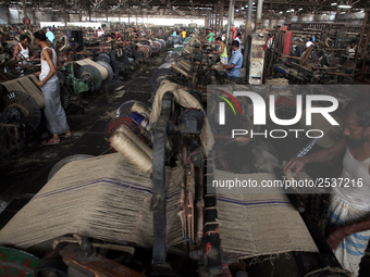 Workers busy in making jute sacks at Latif Bawany Jute Mills in Demra, Dhaka, on 5 March 2018 amid the country is ready to celebrate Nationa...