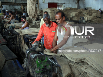 Workers busy in making jute sacks at Latif Bawany Jute Mills in Demra, Dhaka, on 5 March 2018 amid the country is ready to celebrate Nationa...