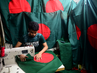 A worker is sewing the national flag of Bangladesh for upcoming event Independence Day on March 26 in Dhaka, Bangladesh, on March 05, 2018....