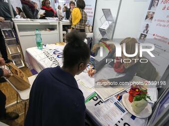 Jobseeker talks with a member of recruitment service at the "Paris pour l'emploi" (Paris for Employment) recruitment forum on March 6, 2018,...