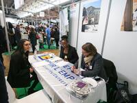 Jobseeker talks with members of recruitment service at the "Paris pour l'emploi" (Paris for Employment) recruitment forum on March 6, 2018,...