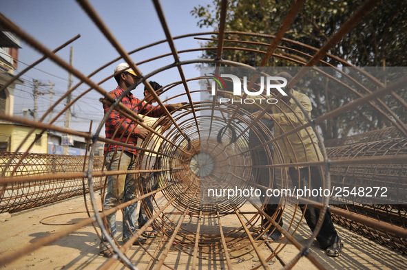 Migrated workers from India working at on-going Bridge expansion work supported by China AID at Tinkune, Kathmandu, Nepal on Thursday, March...