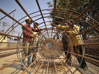 Migrated workers from India working at on-going Bridge expansion work supported by China AID at Tinkune, Kathmandu, Nepal on Thursday, March...