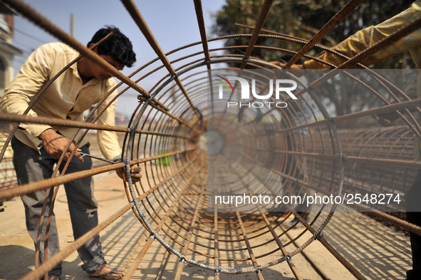 Migrated workers from India working at on-going Bridge expansion work supported by China AID at Tinkune, Kathmandu, Nepal on Thursday, March...