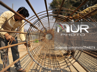 Migrated workers from India working at on-going Bridge expansion work supported by China AID at Tinkune, Kathmandu, Nepal on Thursday, March...