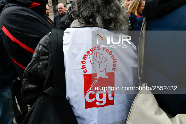 Striking Air France employees hold flags of French union CGT on March 12, 2018 in Paris, during a demonstration in front of the Palace of Ju...