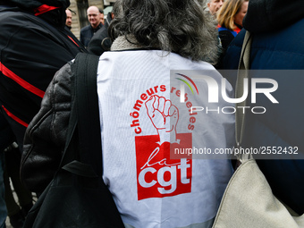 Striking Air France employees hold flags of French union CGT on March 12, 2018 in Paris, during a demonstration in front of the Palace of Ju...