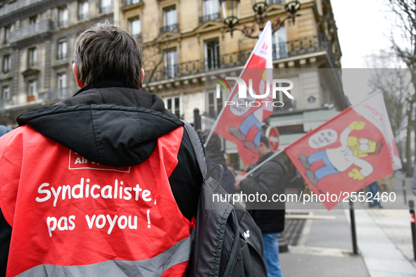 Striking Air France employees hold flags of French union CGT on March 12, 2018 in Paris, during a demonstration in front of the Palace of Ju...