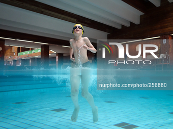 London, Robin at eight years old during his swimming lesson decided to spent time having fun in the water. (