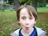 London, Robin at seven years old in his favorite park impressed watching the camera (