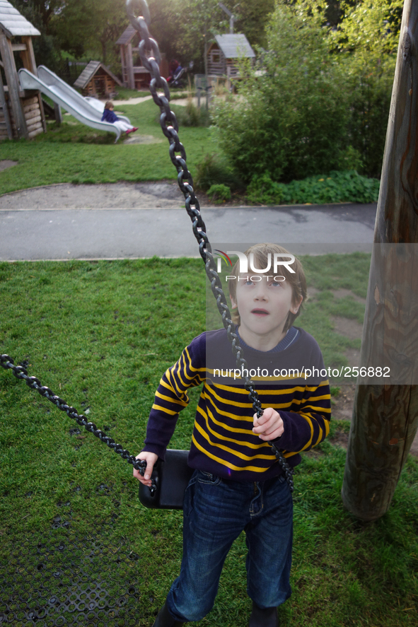 London, Robin at seven years old in Brokwell park having fun. 