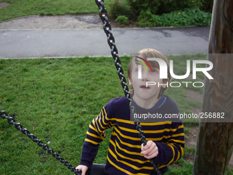 London, Robin at seven years old in Brokwell park having fun. (