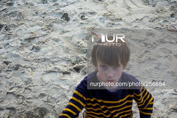 London, Robin at eight years old in the park, very hap set after have not  received attention on his daily games. This mood went on till the...