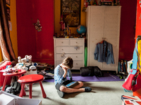 London, Robin at eight years old in his room watching cartoon. (