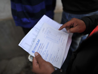 Nepalese Youths filling the pay slip of the amount for the application submission for the Korean Language Test (KLT) under the Korea Employm...