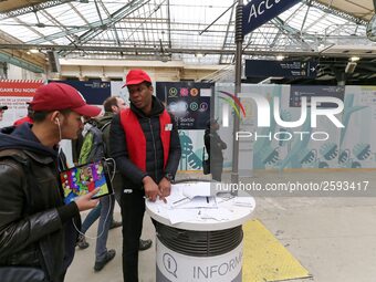 SNCF (French National Railway Corporation) employee speak with travellers to inform them on a platform of the Gare de l’Est railway station...