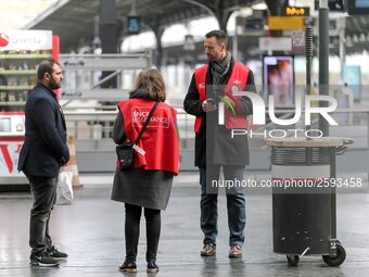 SNCF (French National Railway Corporation) employees speak with travellers to inform them on a platform of the Gare de l’Est railway station...