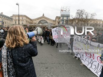 French students protest with employees of the French state owned railway company SNCF during a demonstration in front of the Gare de l’Est t...